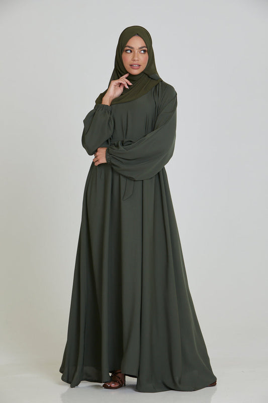 Front full view of plain olive umbrella abaya with belted waist and cuff sleeves, premium modest Islamic wear