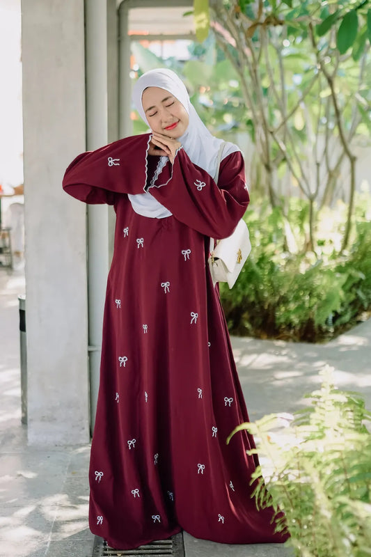 Front view of Red Bow Embroidered Zoom Nida Abaya showcasing bow embroidery on Zoom Nida fabric.
