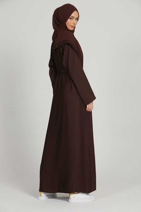 Side full view of brown simple long abaya, elegant modest outfit for women in Pakistan