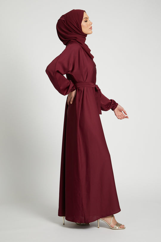 Side full view of modest red kimono abaya with belted waist and elasticated sleeves, abaya for women