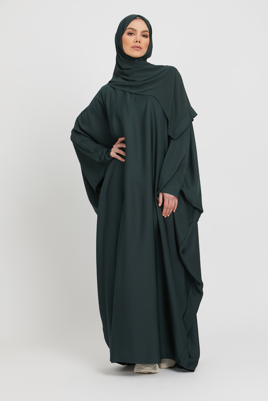 Front view of dark green kaftan abaya designed in loose fit style, modest abaya outfit for women in Pakistan