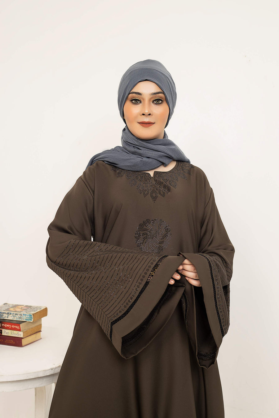 Zoom-in showcasing front style of butterfly sleeve abaya, trendy modest fashion in Pakistan