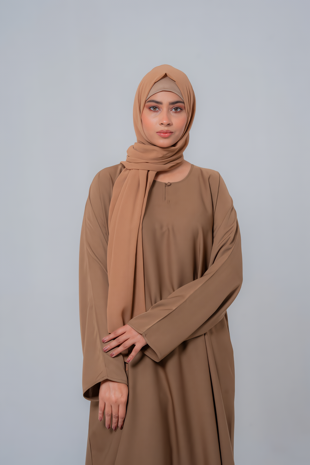 Zoom-in of The Basic Simple Beige Abaya front showing premium fabric texture, stitching details, and modest elegant design for women