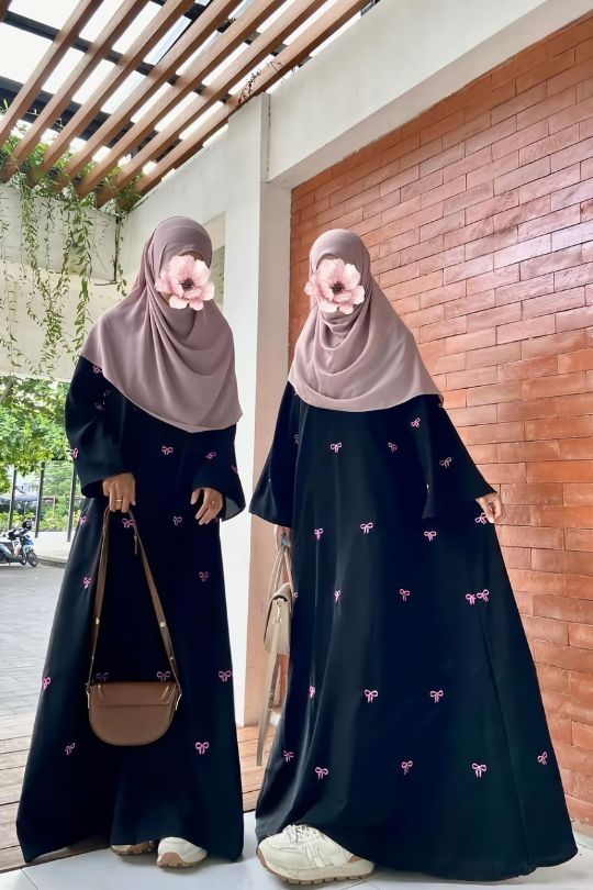 Front view of Trendy Bow Maxi Abaya highlighting bow design and elegant full-length modest wear for women