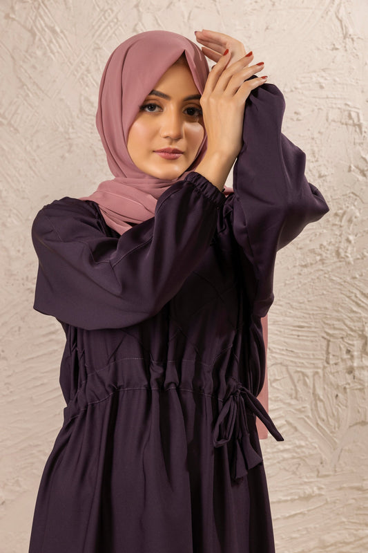 Zoom-in of front waist belt and pintex design on abaya with cuffed sleeves, stylish modest abaya for women
