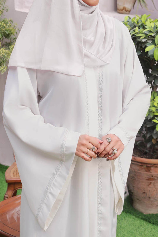 Close-up front zoom of white Nida fabric abaya highlighting premium imported fabric and elegant finish