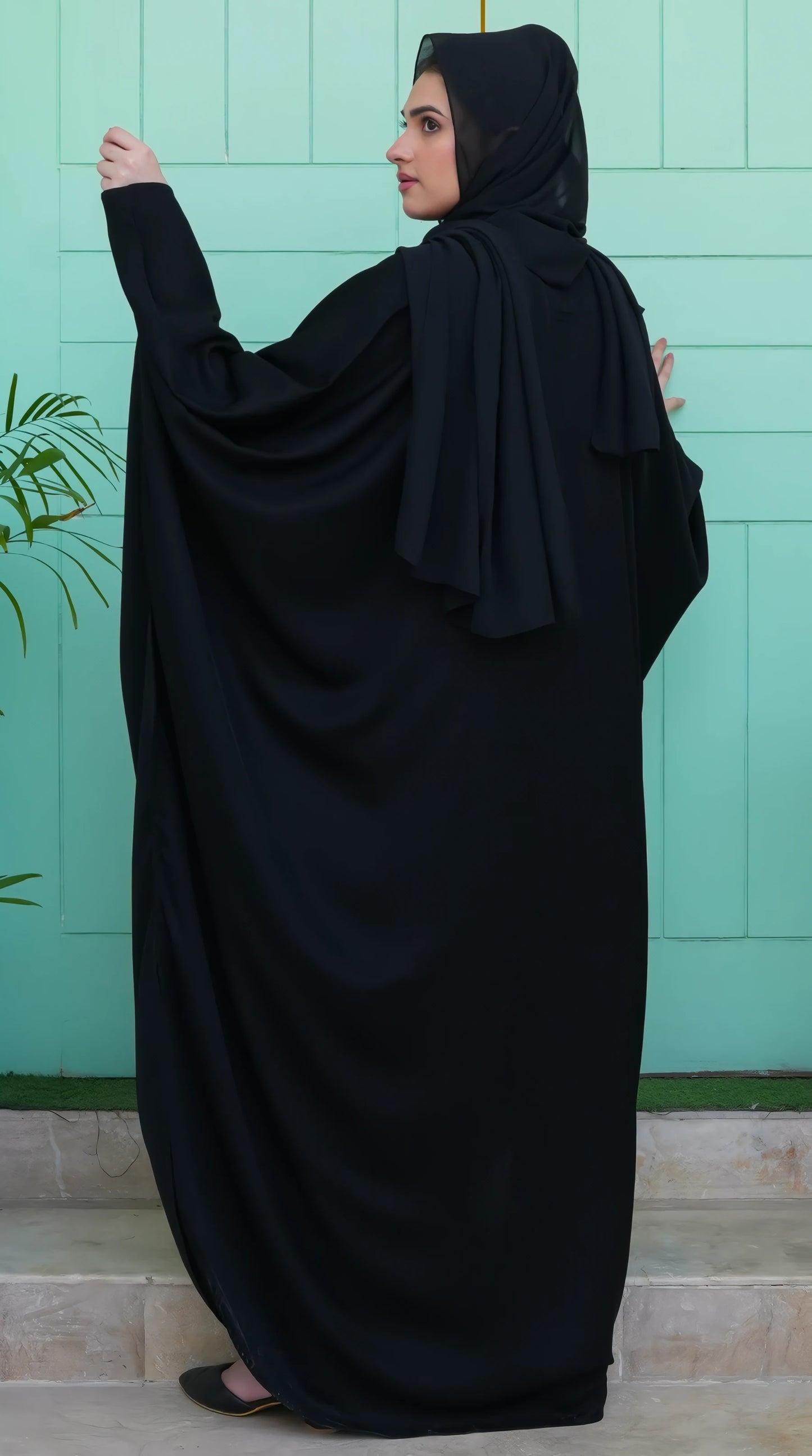 Back view of Black Premium Kaftan – featuring elegant flow, clean stitching, and full-length modest drape.