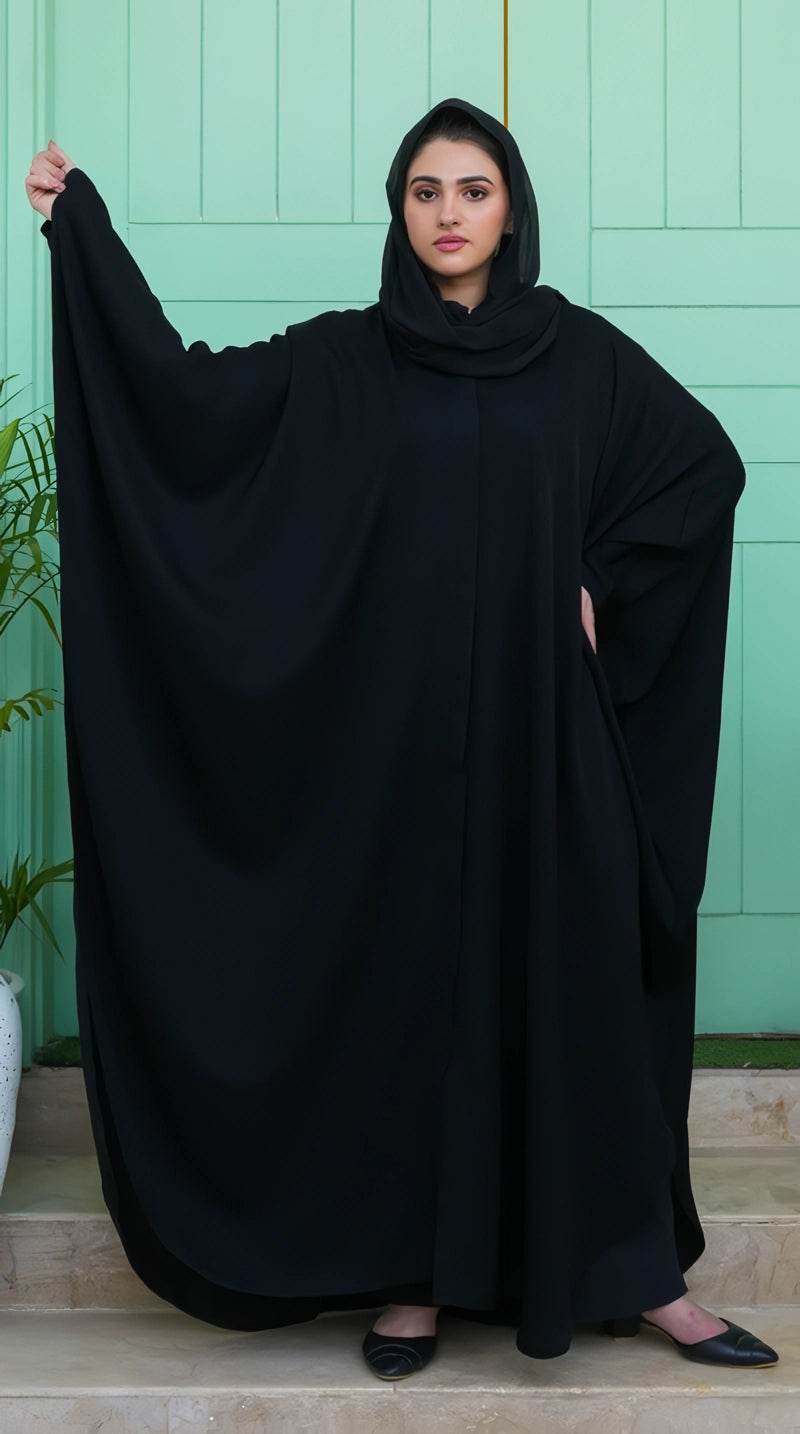 Black Premium Kaftan front view showing its smooth front fall, graceful movement, and luxurious fabric finish.