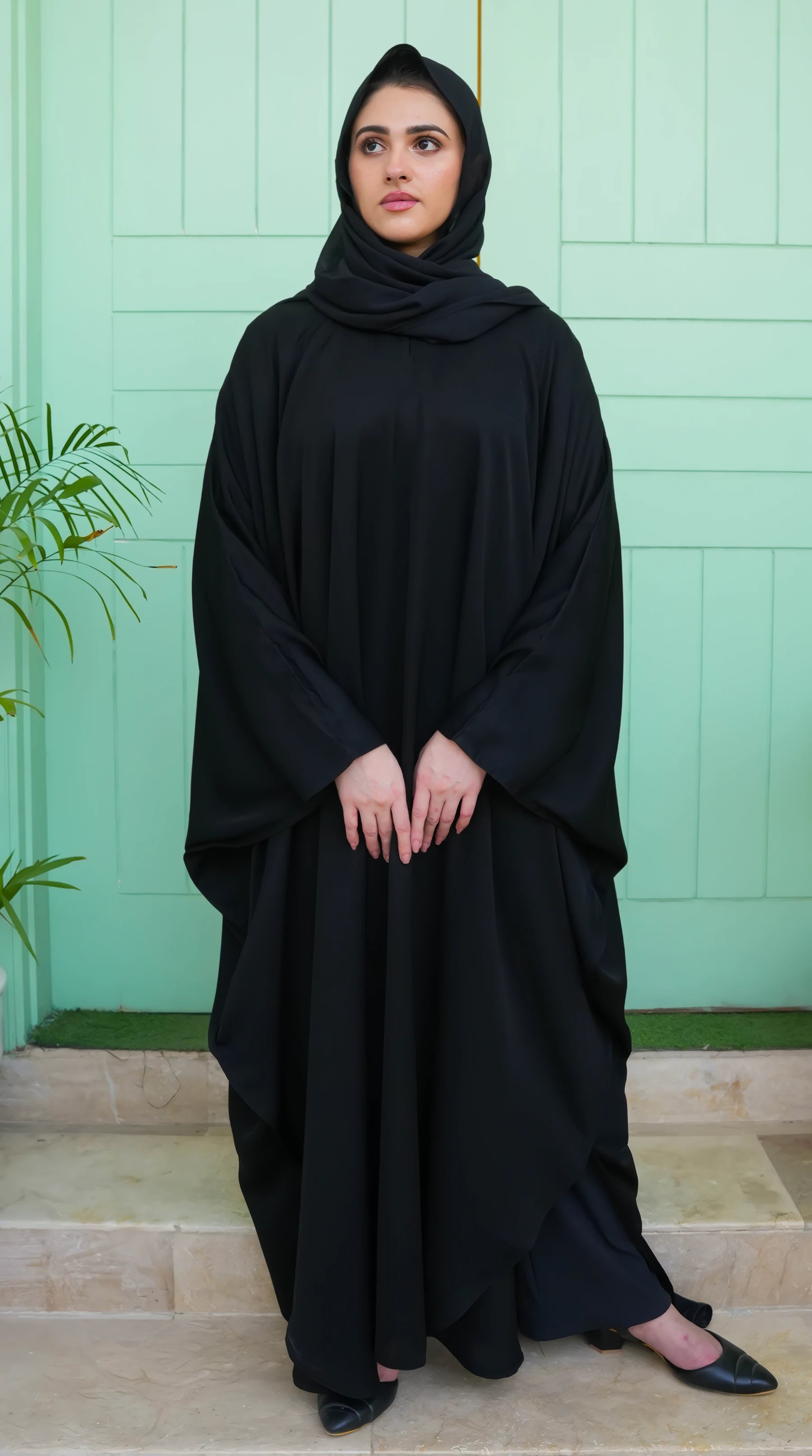 Model wearing Black Premium Kaftan – showcasing elegant front design, modest flow, and sophisticated appearance.