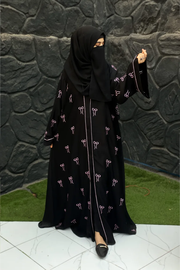 : Front view of modern Bow Abaya for women, crafted from high-quality Nida fabric featuring stylish pink bow details and open-front elegance.