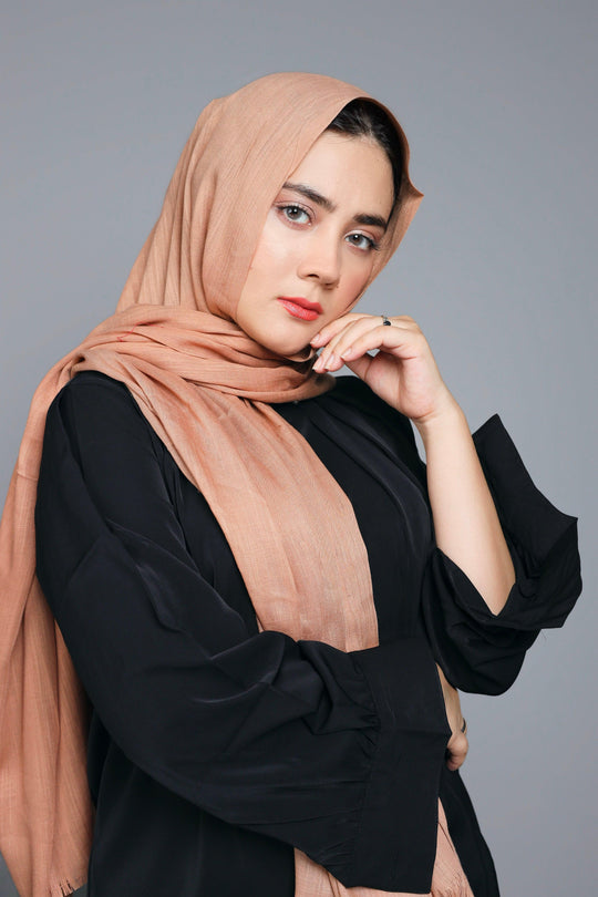 Front draped look of Turkish Viscose Hijab in Warm Peach – elegant modest hijab style for women 2025