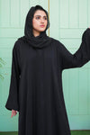 Half zoom-in view showing the smooth texture and fine stitching of the Classic Black Front Open Abaya in Nida fabric.