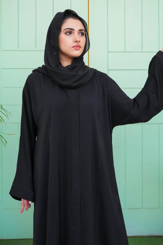 Half zoom-in view showing the smooth texture and fine stitching of the Classic Black Front Open Abaya in Nida fabric.