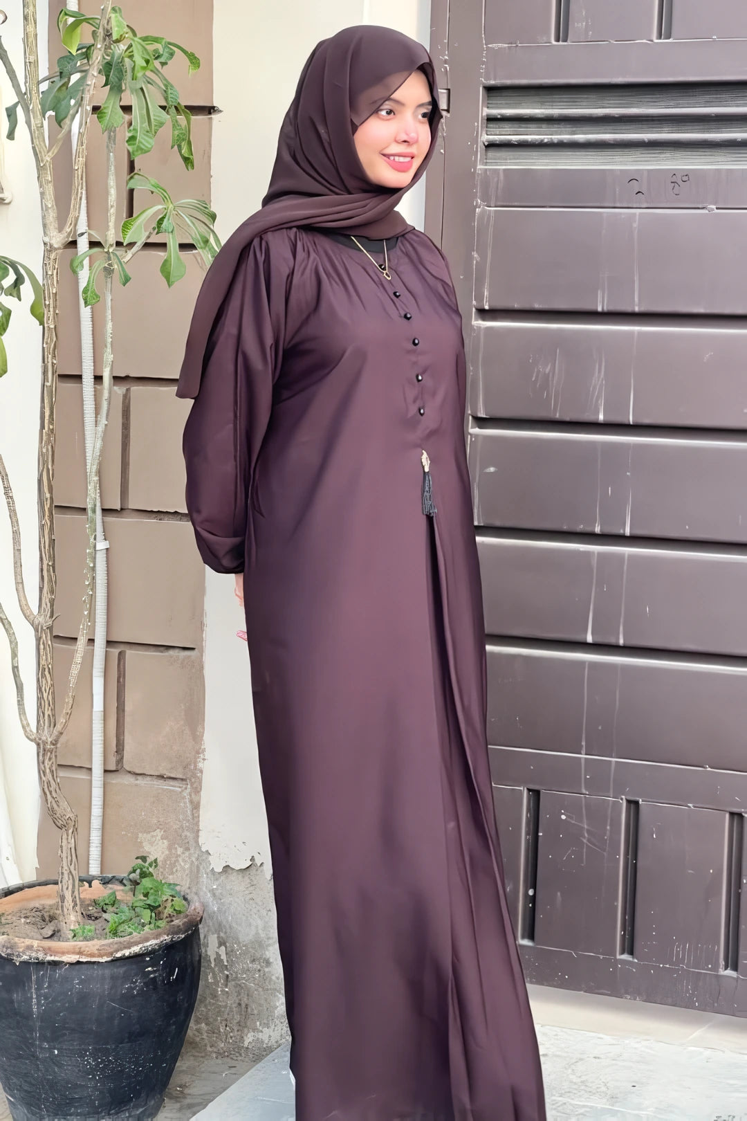 Side Angle View of Dark Brown Front Close Abaya with Decorative Stone Buttons
