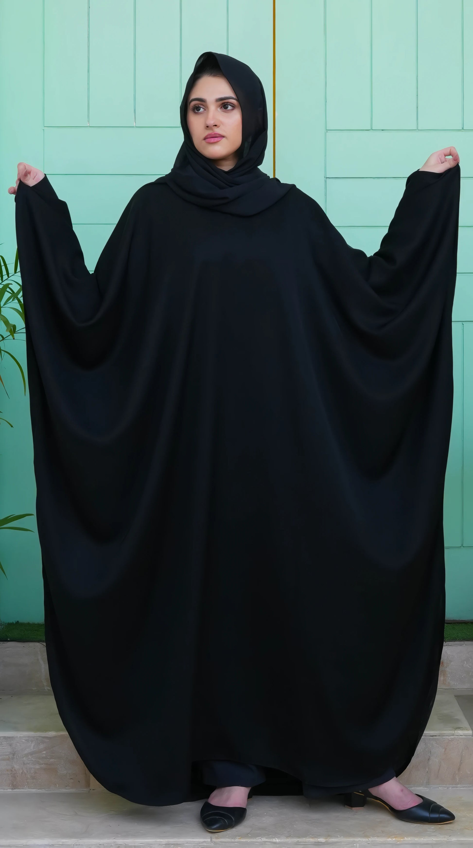 Elegant front look of Black Premium Kaftan featuring soft Nida fabric, flowing cut, and timeless modest wear design.