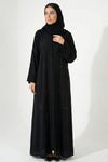 Essence of Dreams handworked abaya for women in black color front full view showing premium nida fabric and bow details