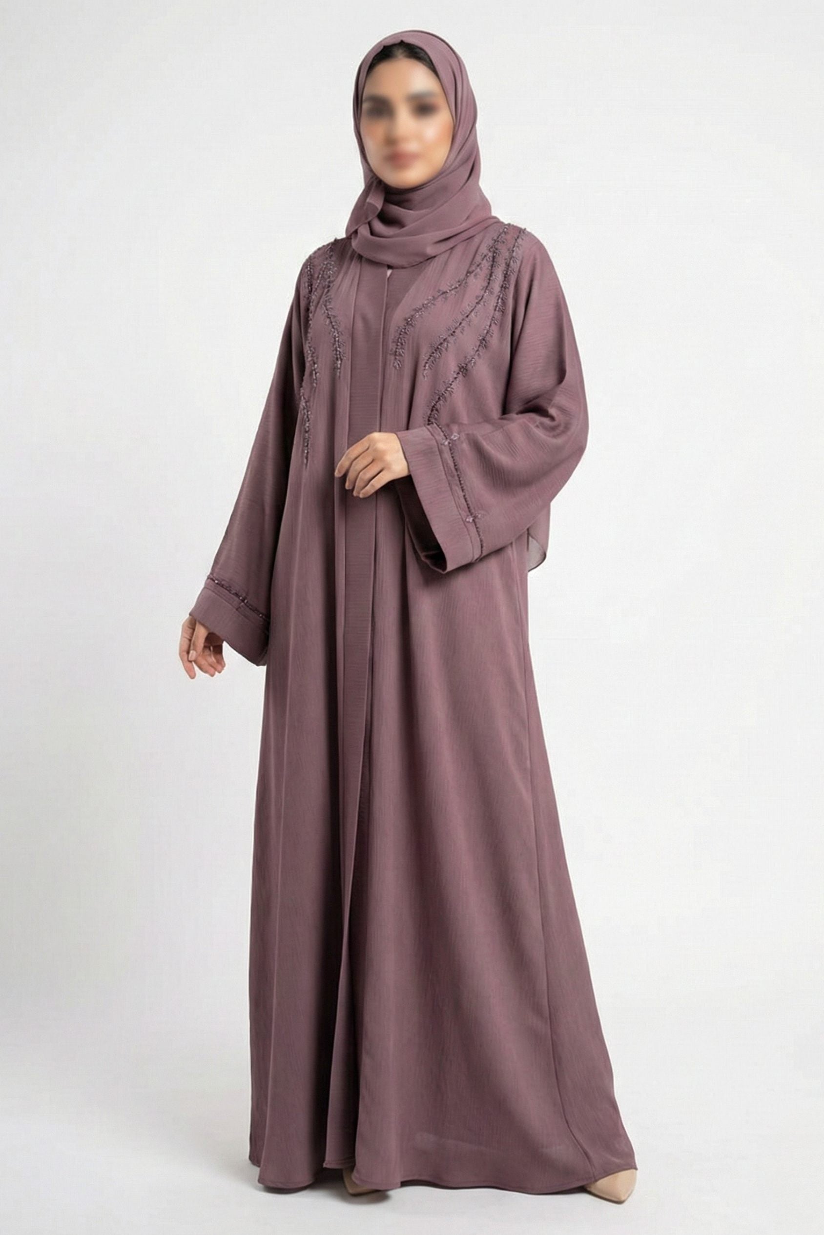 Essence of Dreams handworked abaya for women in soft pink color front full view worn by model showing premium nida fabric