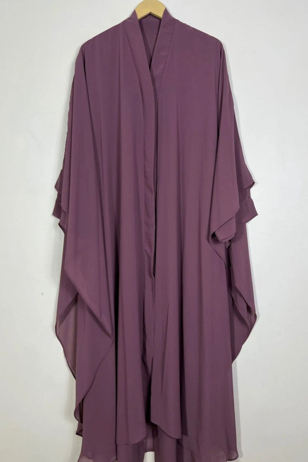 Halimah plum front open butterfly abaya hanging on hanger showing double layer chiffon and soft drape