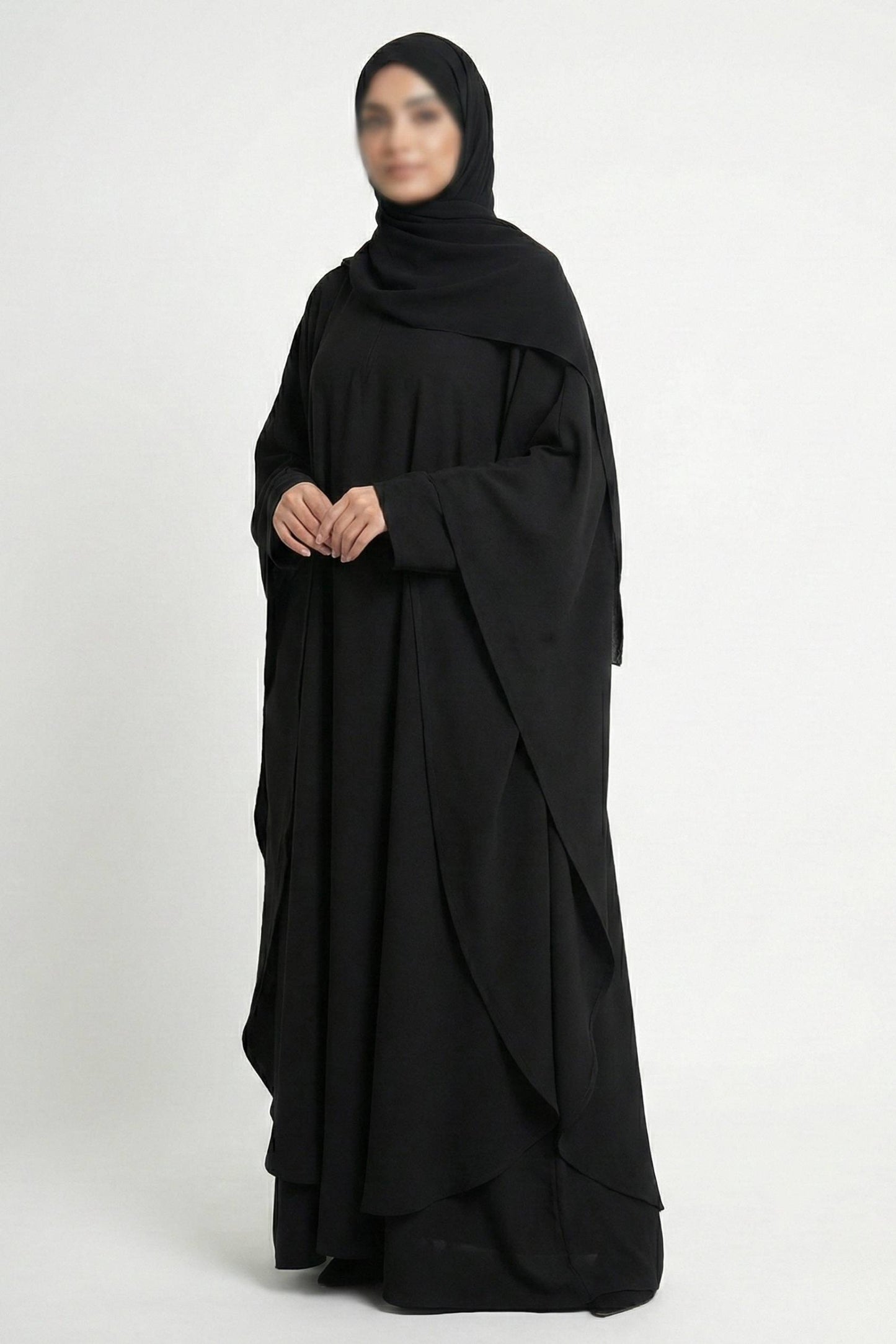 Halimah butterfly abaya for women in black color front full view worn by model showing flowing double layer chiffon fabric