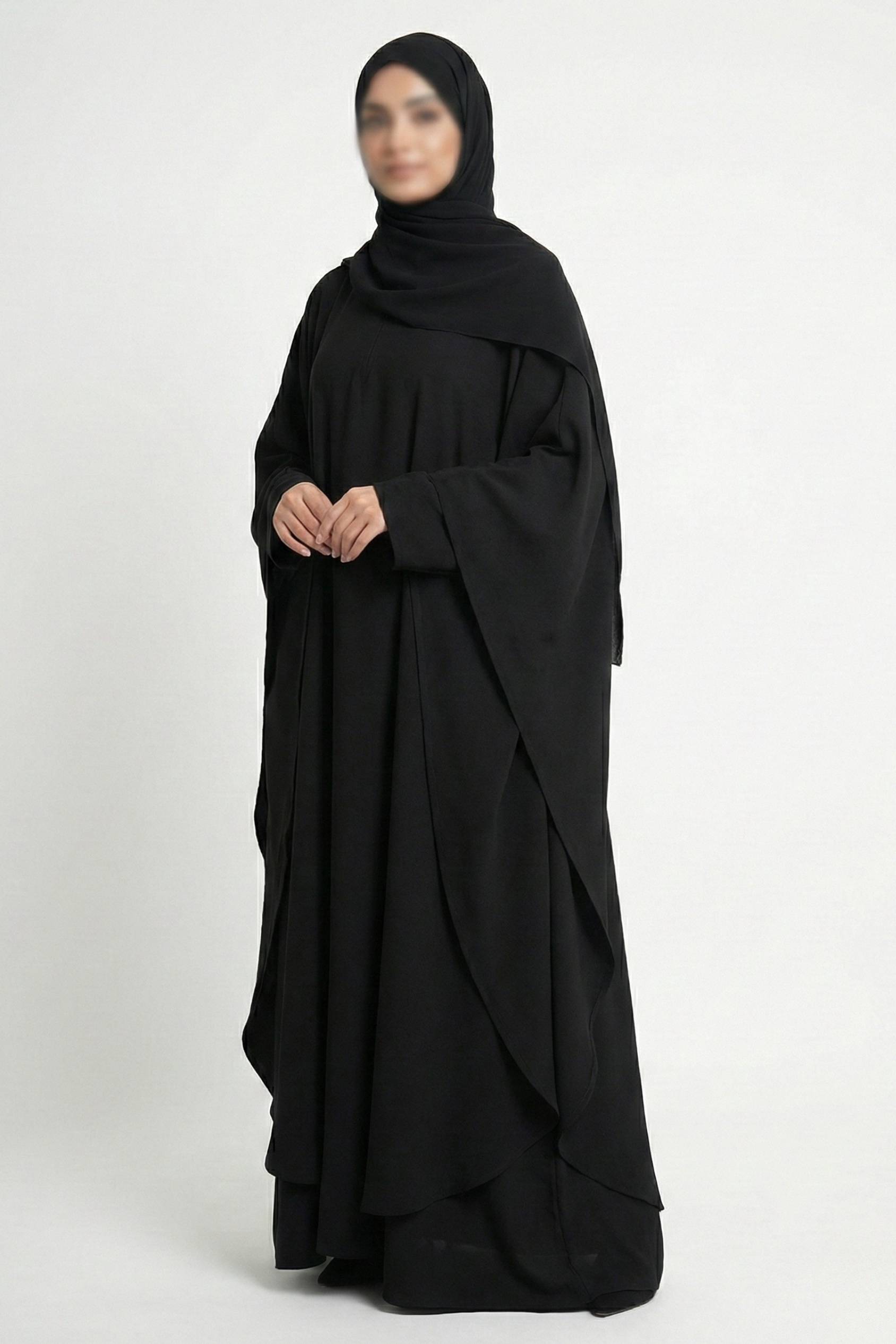 Halimah butterfly abaya for women in black color front full view worn by model showing flowing double layer chiffon fabric