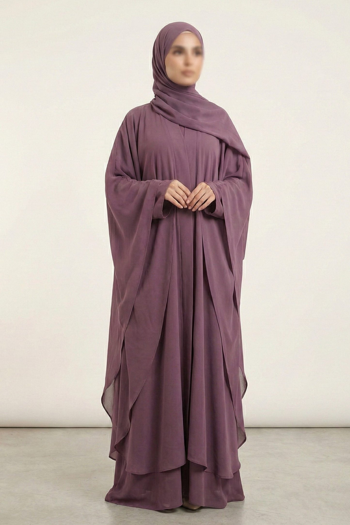 Halimah butterfly abaya for women in plum color front full view worn by model showing flowy double layer chiffon fabric
