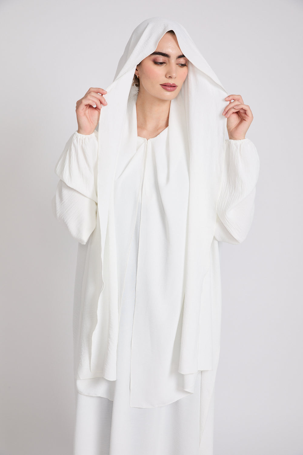 Close-up of White Closed Abaya fabric highlighting soft nida material, smooth stitching, and premium modest finish