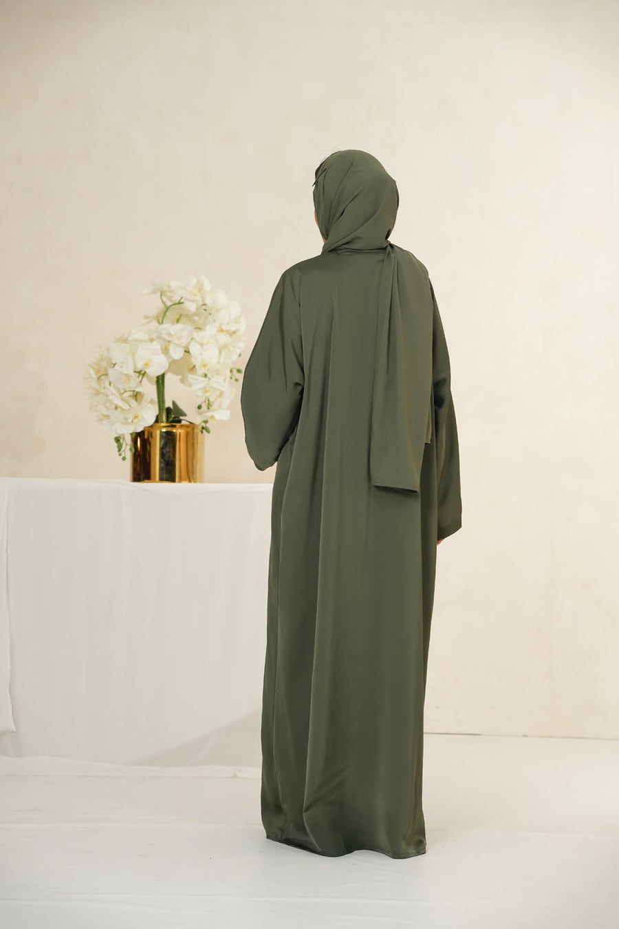 Back full view of Imported TikTok Crinkle Nida Fabric Abaya for women in green color with elegant fall