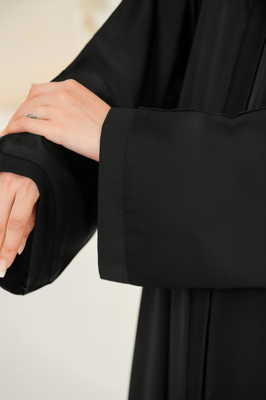 Close-up view of sleeves of Imported TikTok Crinkle Nida Fabric Abaya in black showing fine stitching and crinkle texture