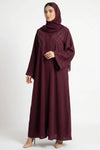 Luxury maroon abaya for women front full view featuring handcrafted bow work and graceful flowing nida fabric