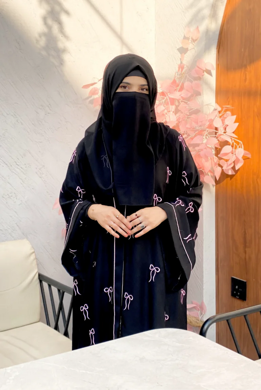 Zoom-in of Elegant Bow Abaya highlighting soft Nida fabric texture, neat stitching, and luxury handcrafted bow detailing.