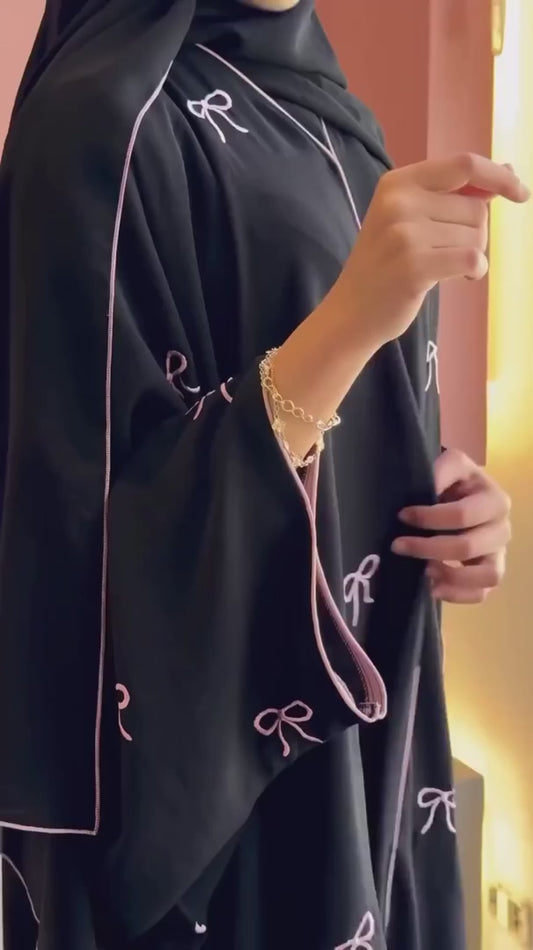 Video of Luxe Bow Abaya showing front, side, and back angles with bow detail for women’s modest fashion