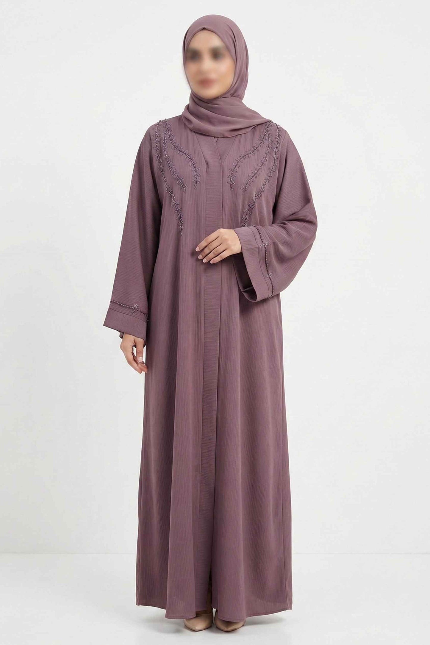 Front full view of soft pink handworked abaya highlighting front open design and delicate bow detailing on sleeves